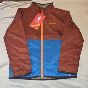 Cotopaxi Kids Reversible Rust and Cobalt Jacket.